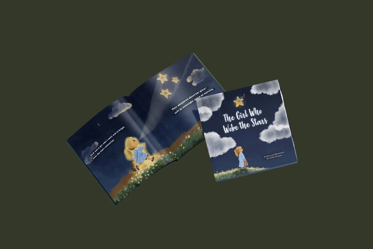The Girl Who Woke the Stars hardcover book shown open with an illustrated interior spread and cover