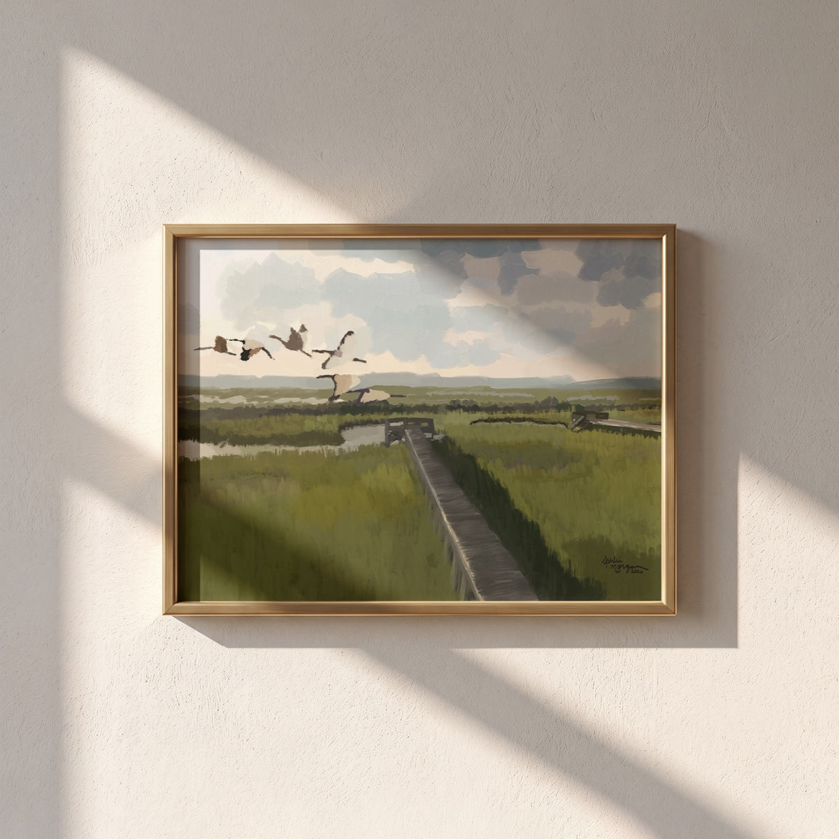 Marsh Crossing fine art print framed in gold on a warm neutral wall
